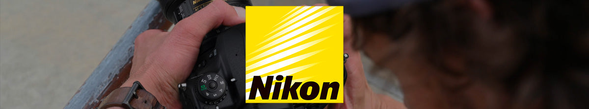 Nikon DSLR Collection Banner Image - Photo of a man holding a DSLR camera