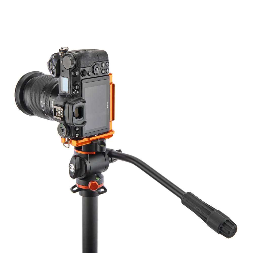 Camera on a tripod with a white background