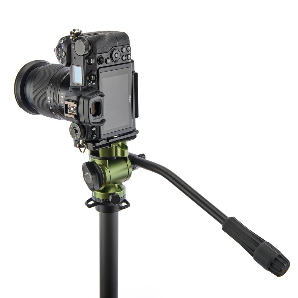 Camera mounted on a tripod with a white background