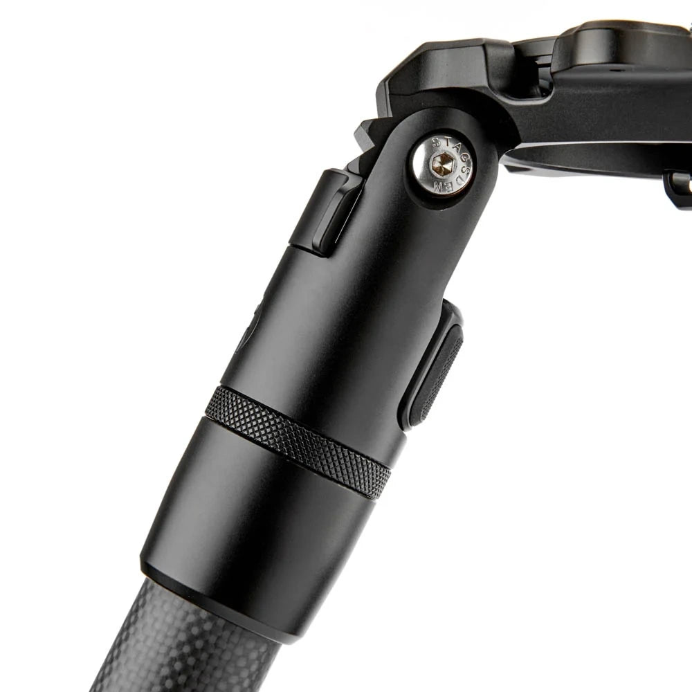 Close-up of a black metal camera tripod joint and handle section on a white background.