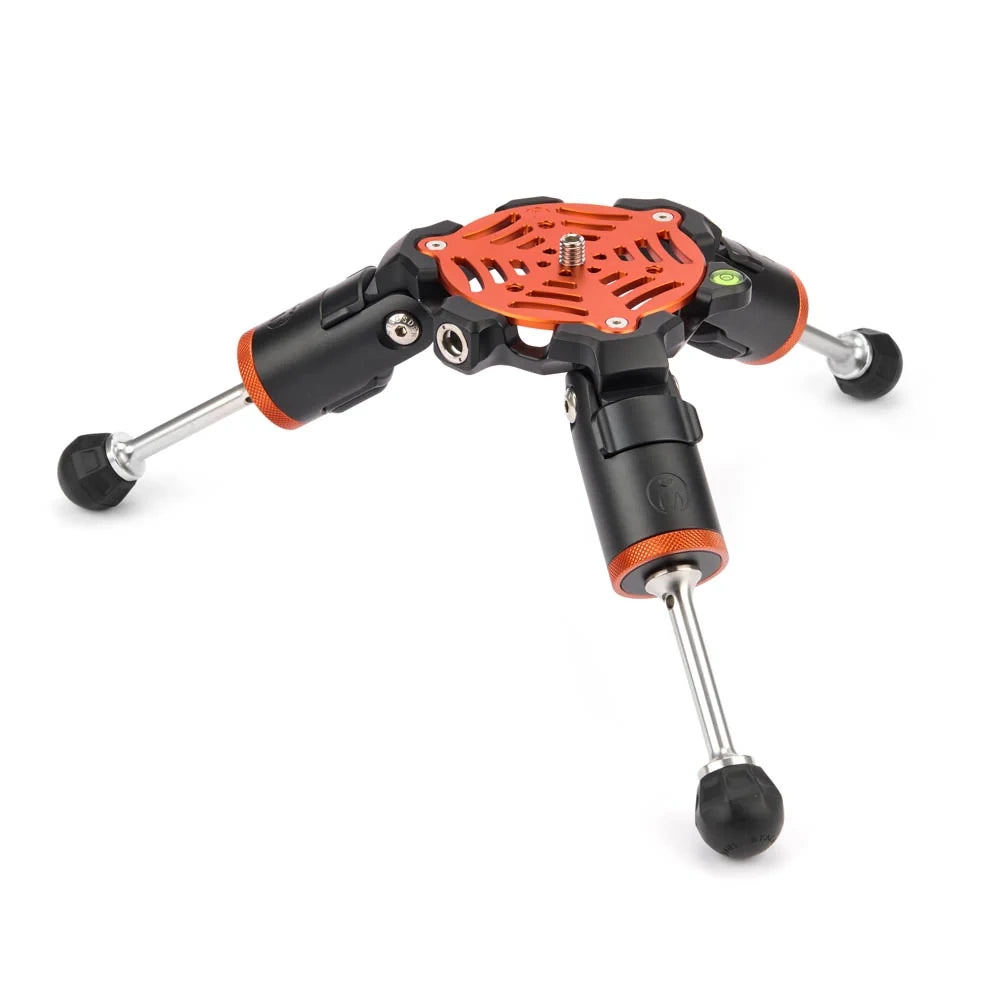 A three-legged tripod-style stand with black and orange plastic components, silver metal legs, and black rubber feet, shown on a plain white background.