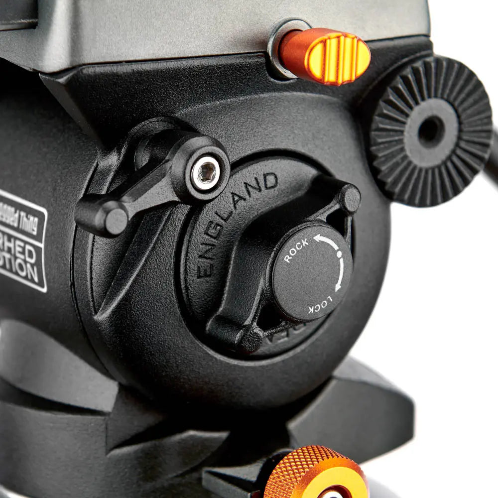 Close-up of a fishing reel with 'England' branding on a white background