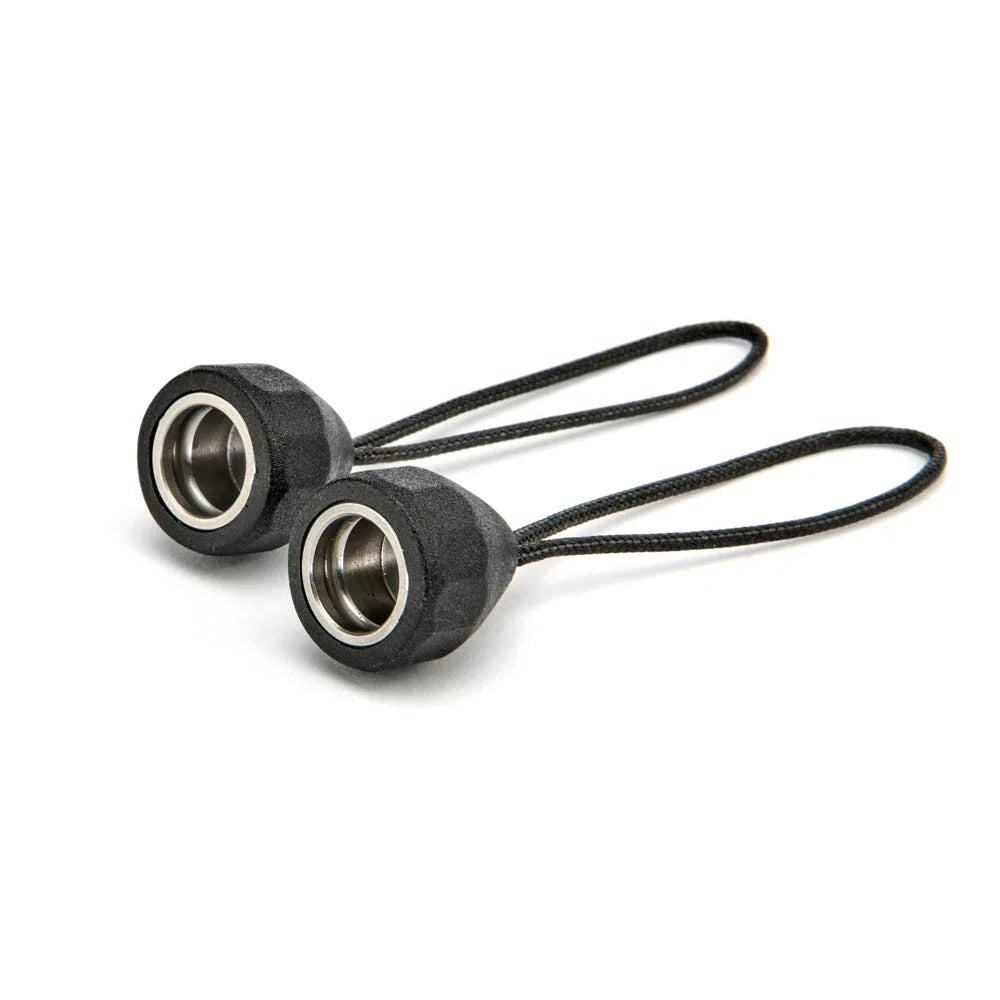 Two black quick detach lug adaptors on a white background