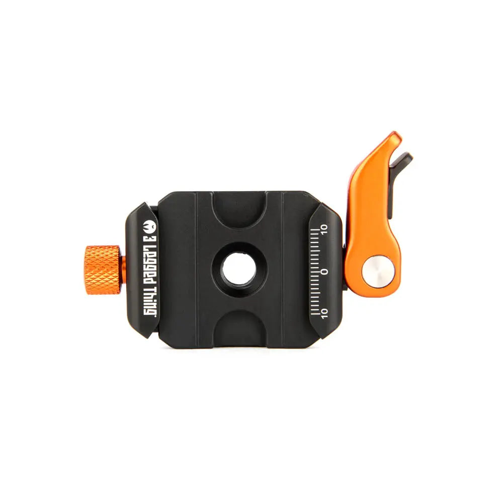 Black and orange tool with measurement scale on a white background