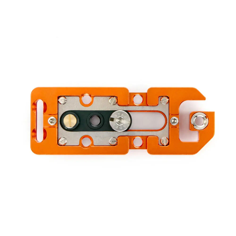 Orange metal tool with various components on a white background