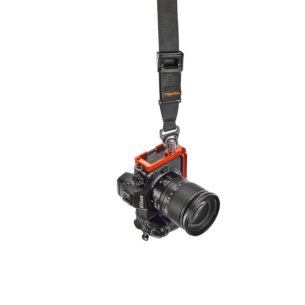 Camera with a strap on a white background