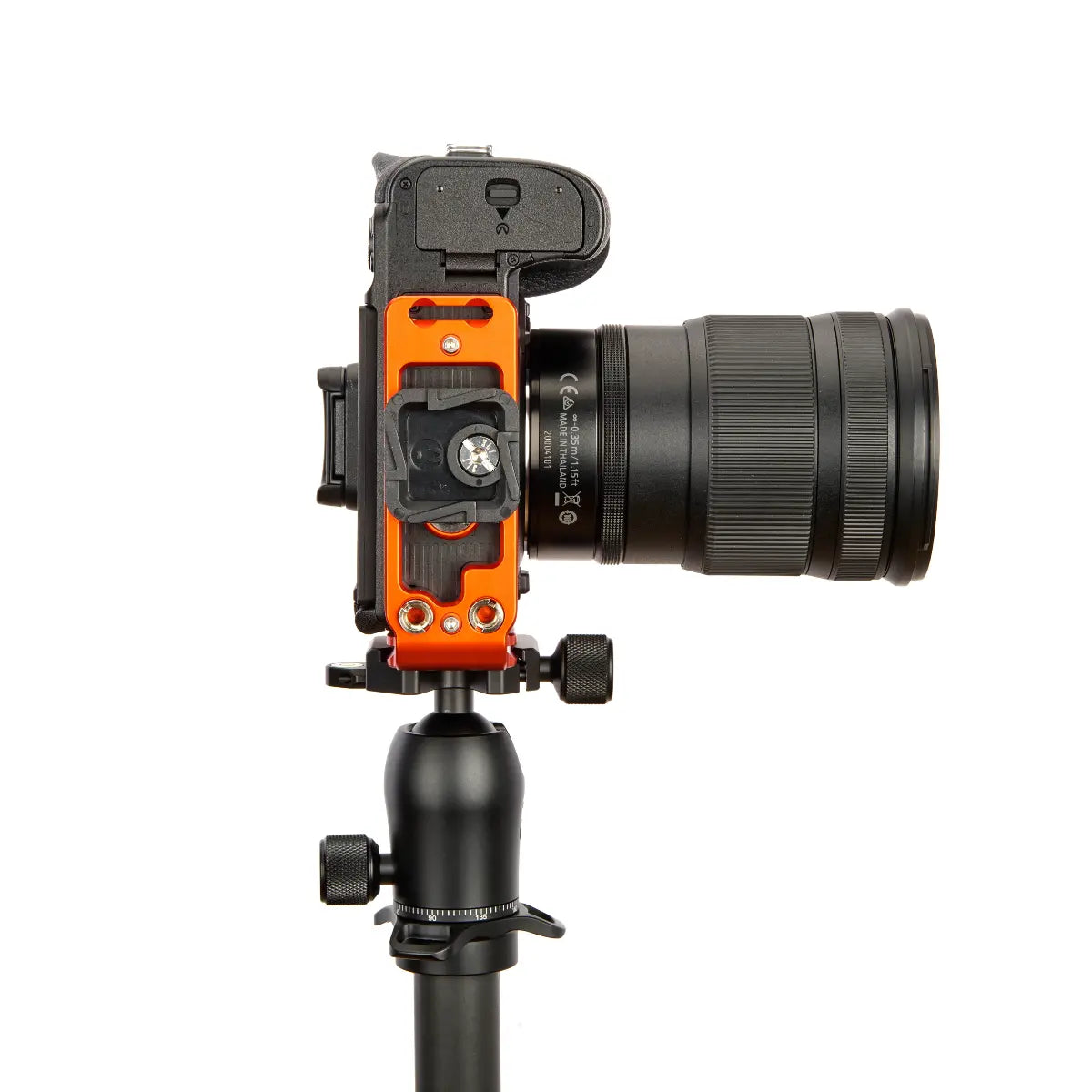 Camera with orange side plate on a white background