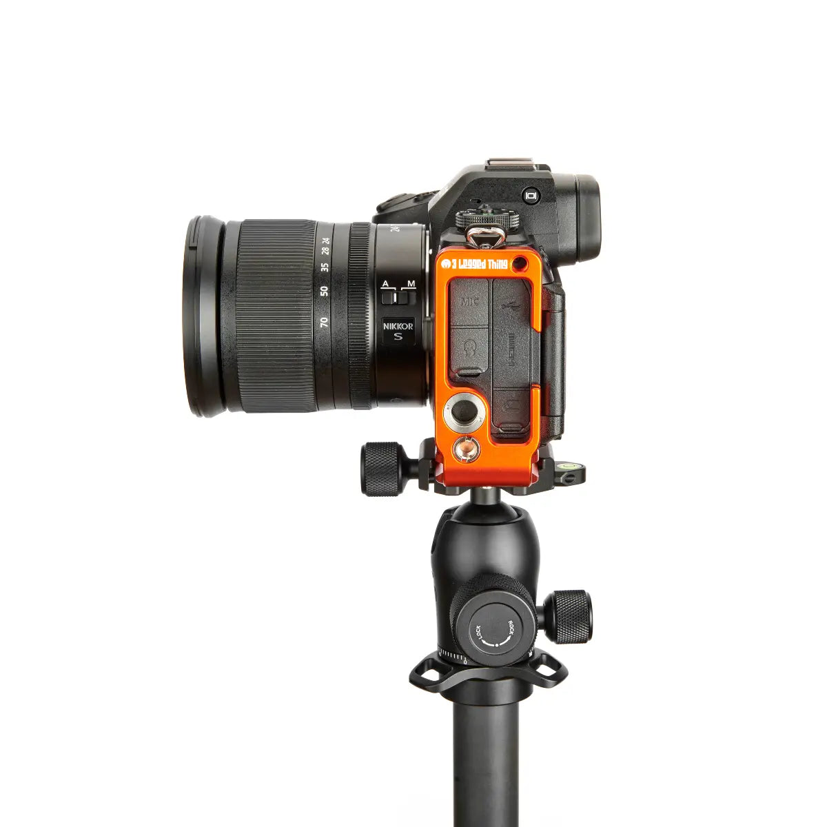 Camera with an orange protective case on a white background
