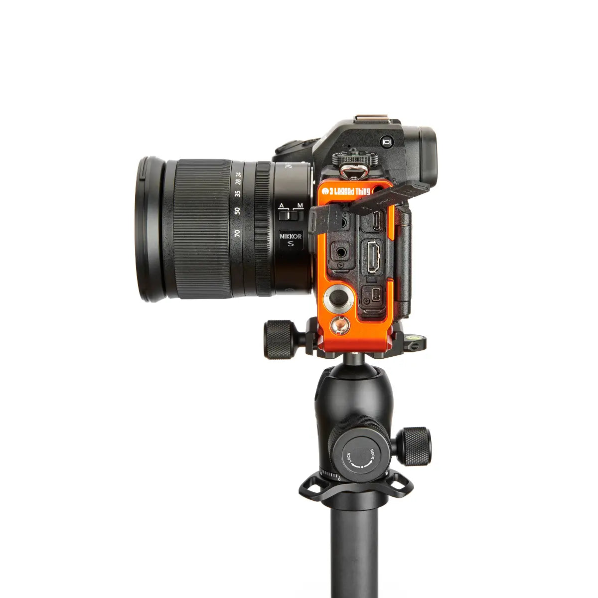 Camera with an orange side panel on a white background