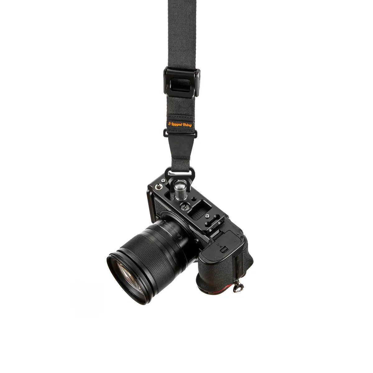 Camera with lens and strap on a white background