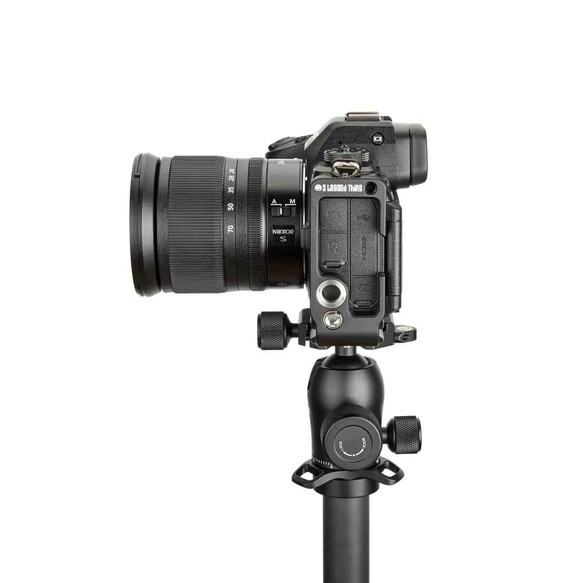 Camera on a tripod with a white background