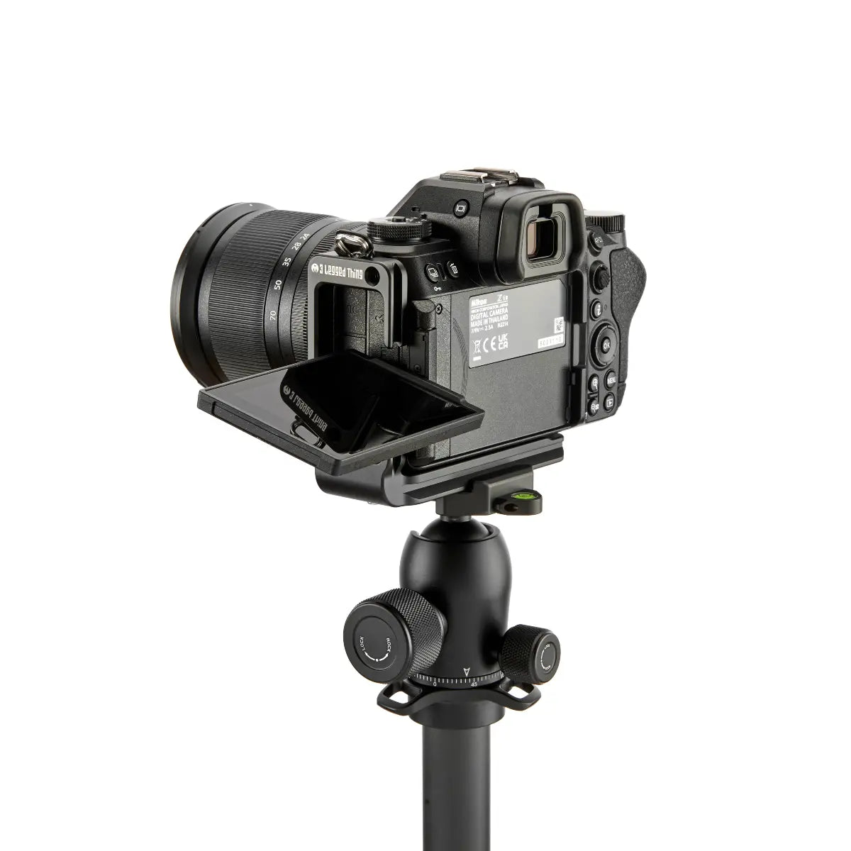 Camera on a tripod with a white background