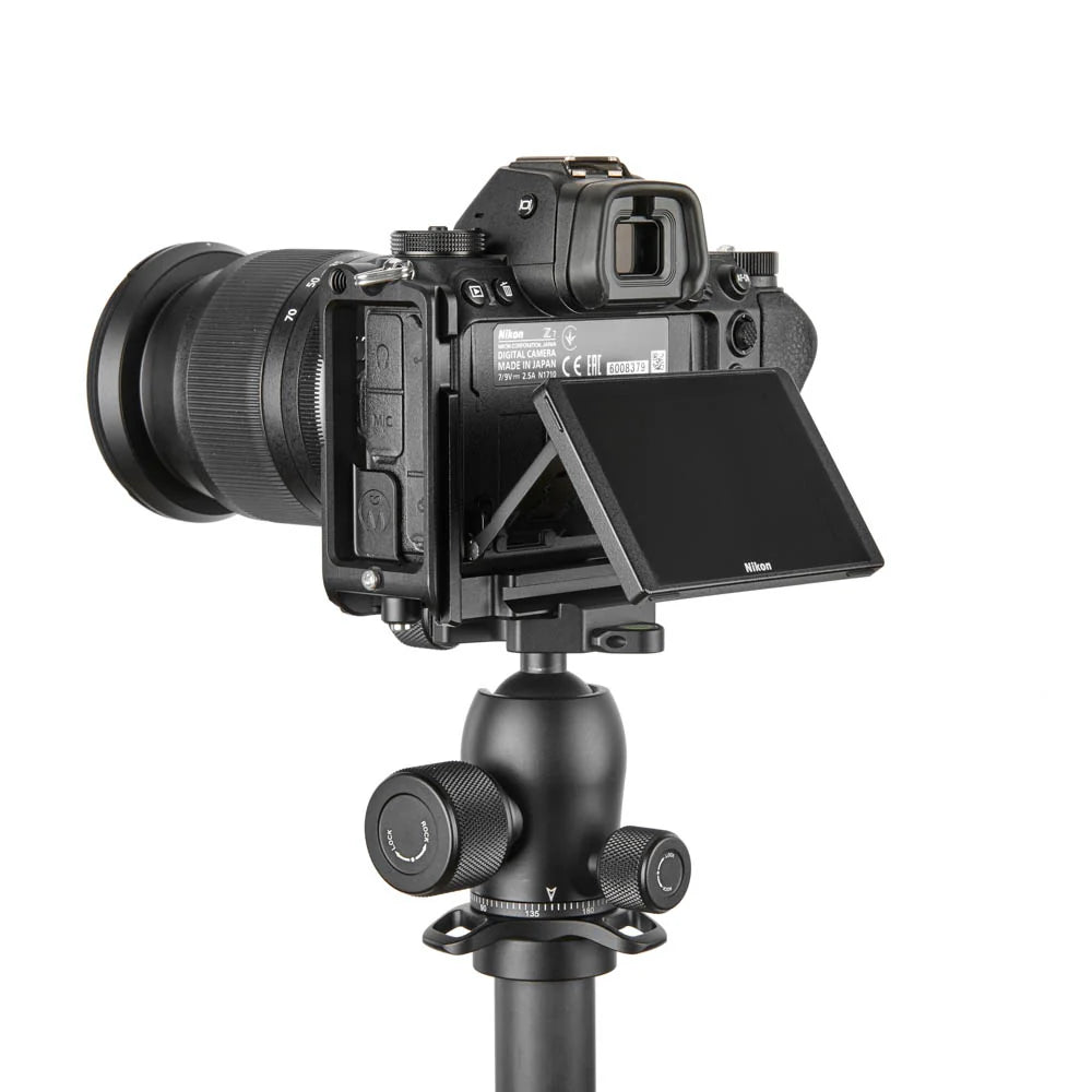 Camera on a tripod with a white background
