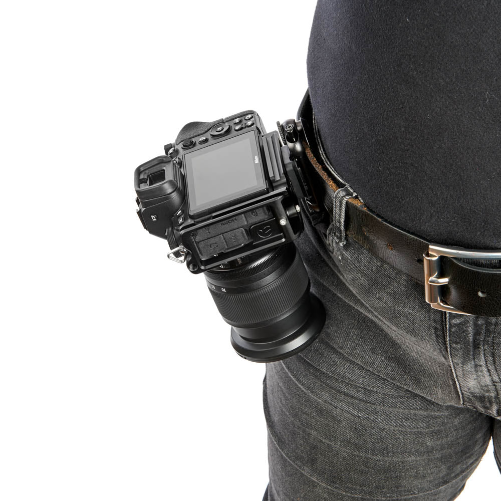 Camera attached to a belt on a white background