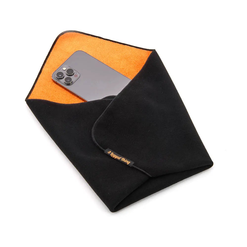 Black and orange fabric with a phone inside on a white background