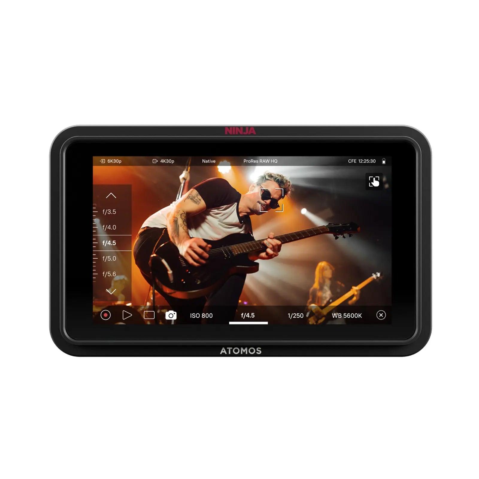 Display device showing a music video with a guitarist on screen, branded 'ATOMOS'.