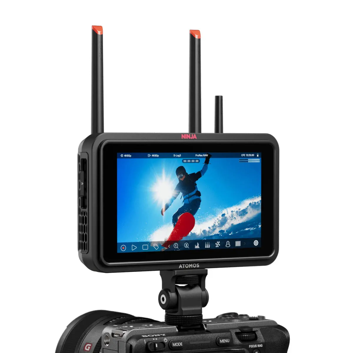 Camera monitor with screen displaying a snowboarder and Atomos branding.