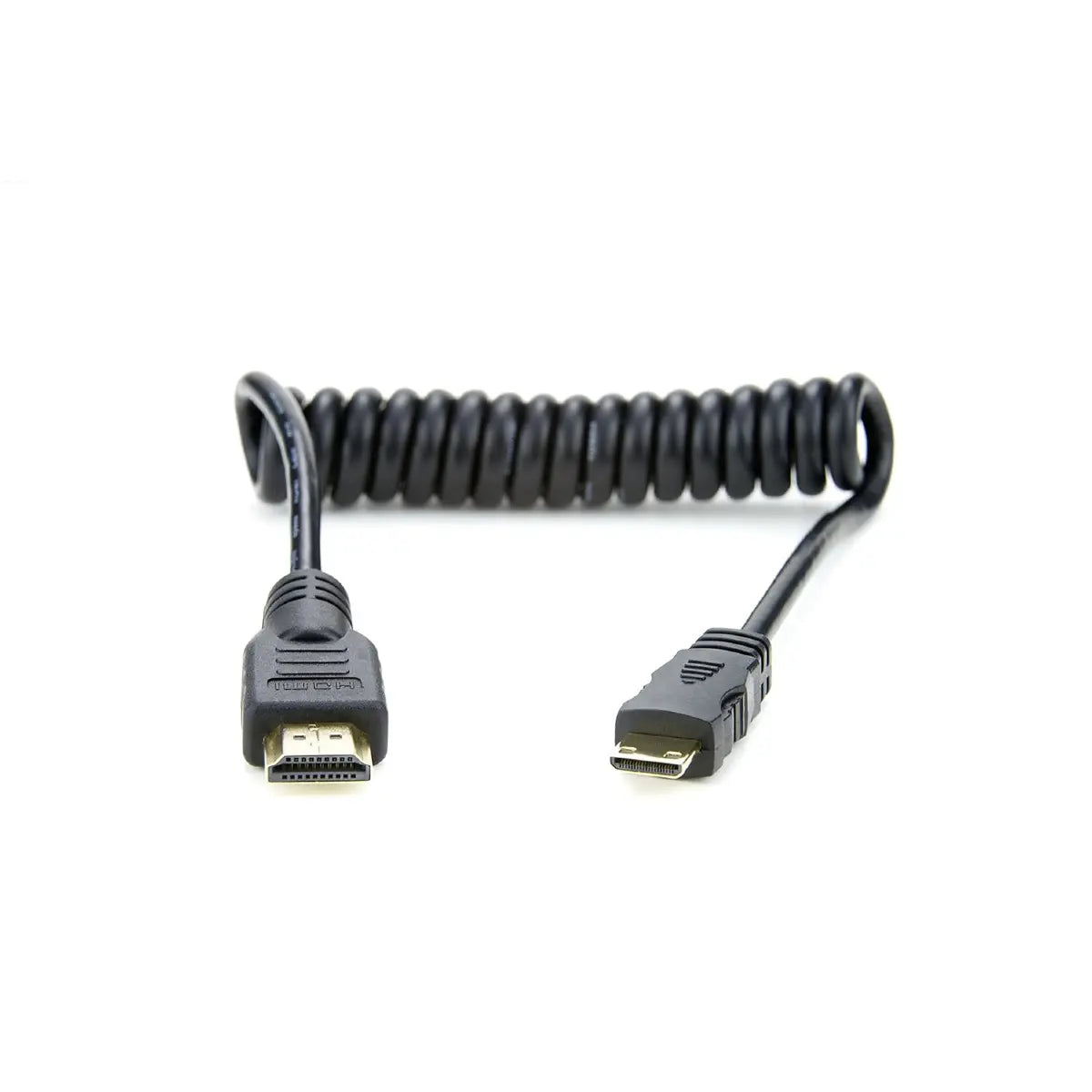 Coiled HDMI cable with one end on a white background