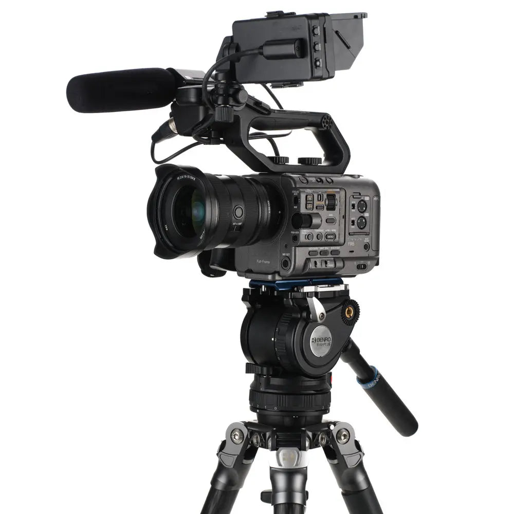 Professional video camera on a tripod with a white background