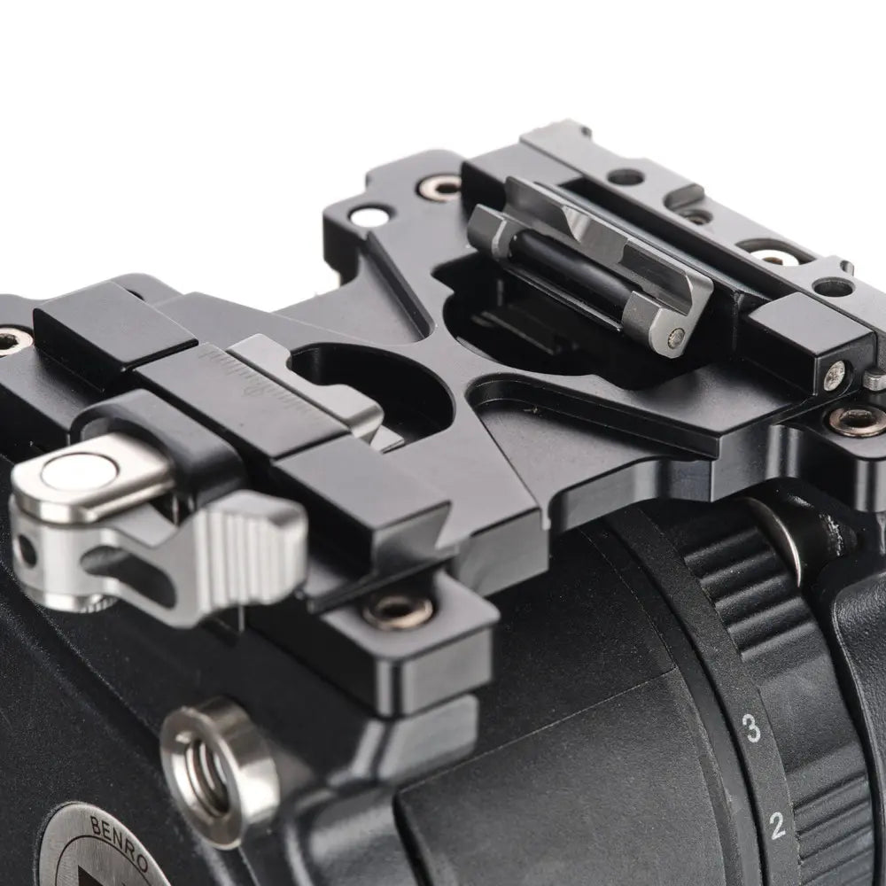 Close-up of a camera mount with multiple attachment points on a white background