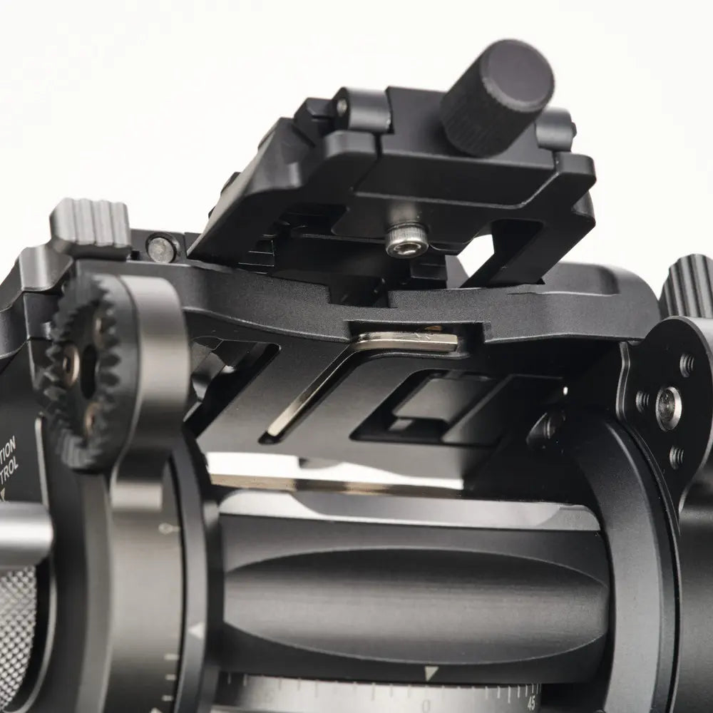 Close-up of a mechanical device with gears and a lever on a white background