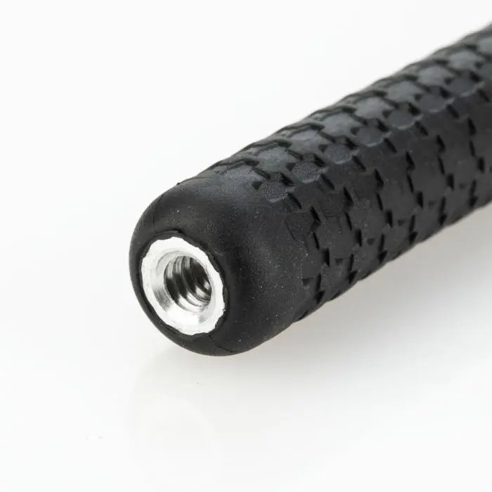 Close-up of a black textured grip with a metallic thread on a white background