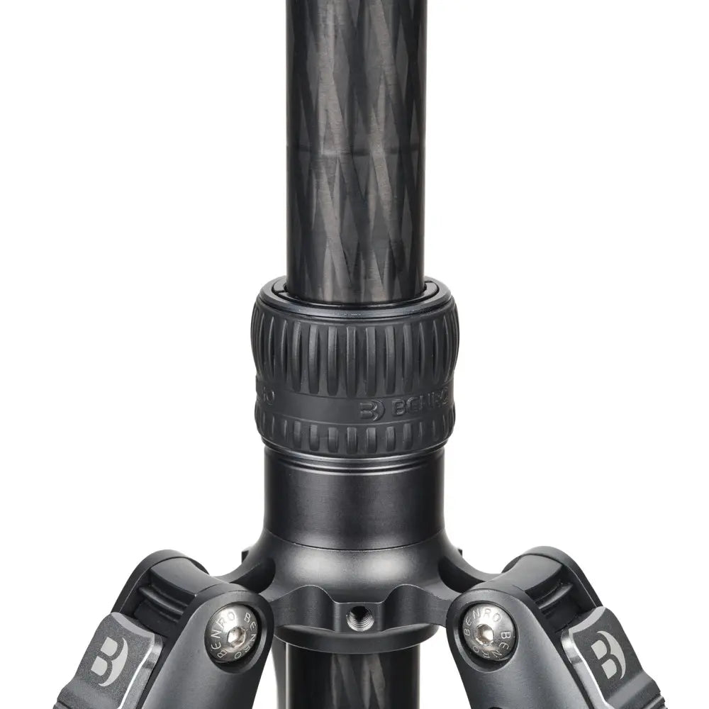 Close-up of a black tripod with brand logo on a white background