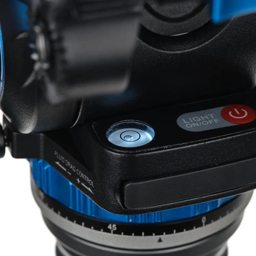 Close-up of a camera lens with control buttons on a white background