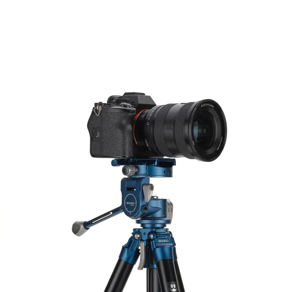 Camera on a blue tripod with a white background
