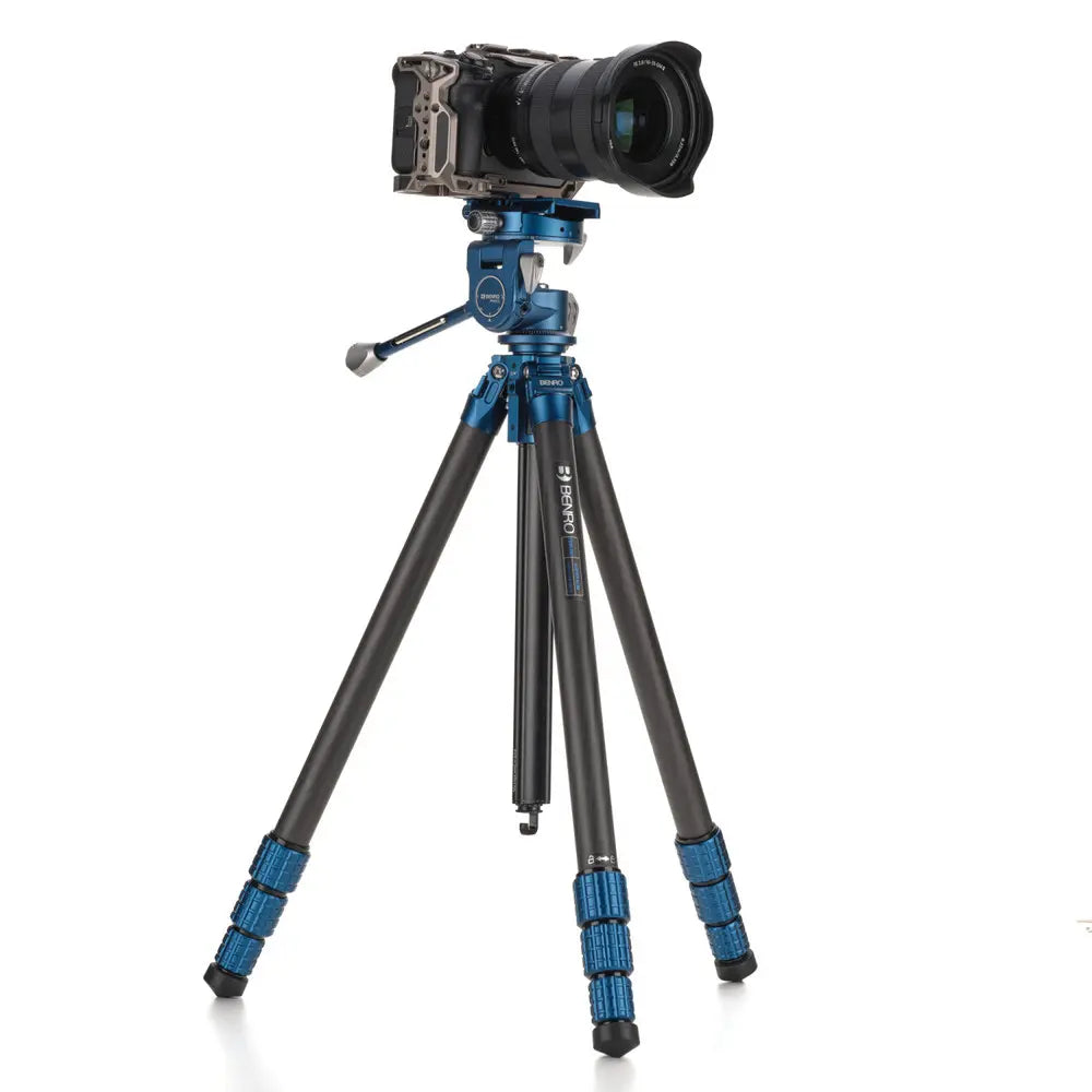 Camera on a tripod with a white background