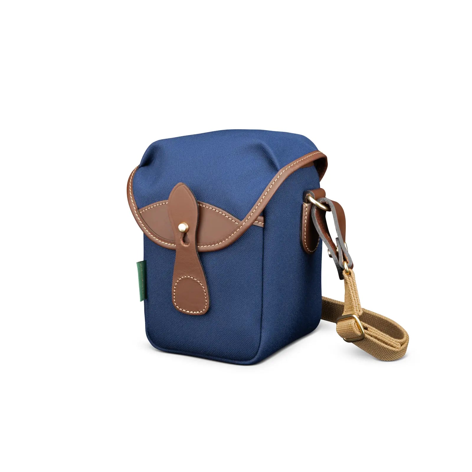 Blue bag with brown leather accents on a white background