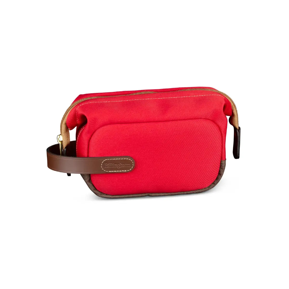 Red toiletry bag with brown leather accents on a white background