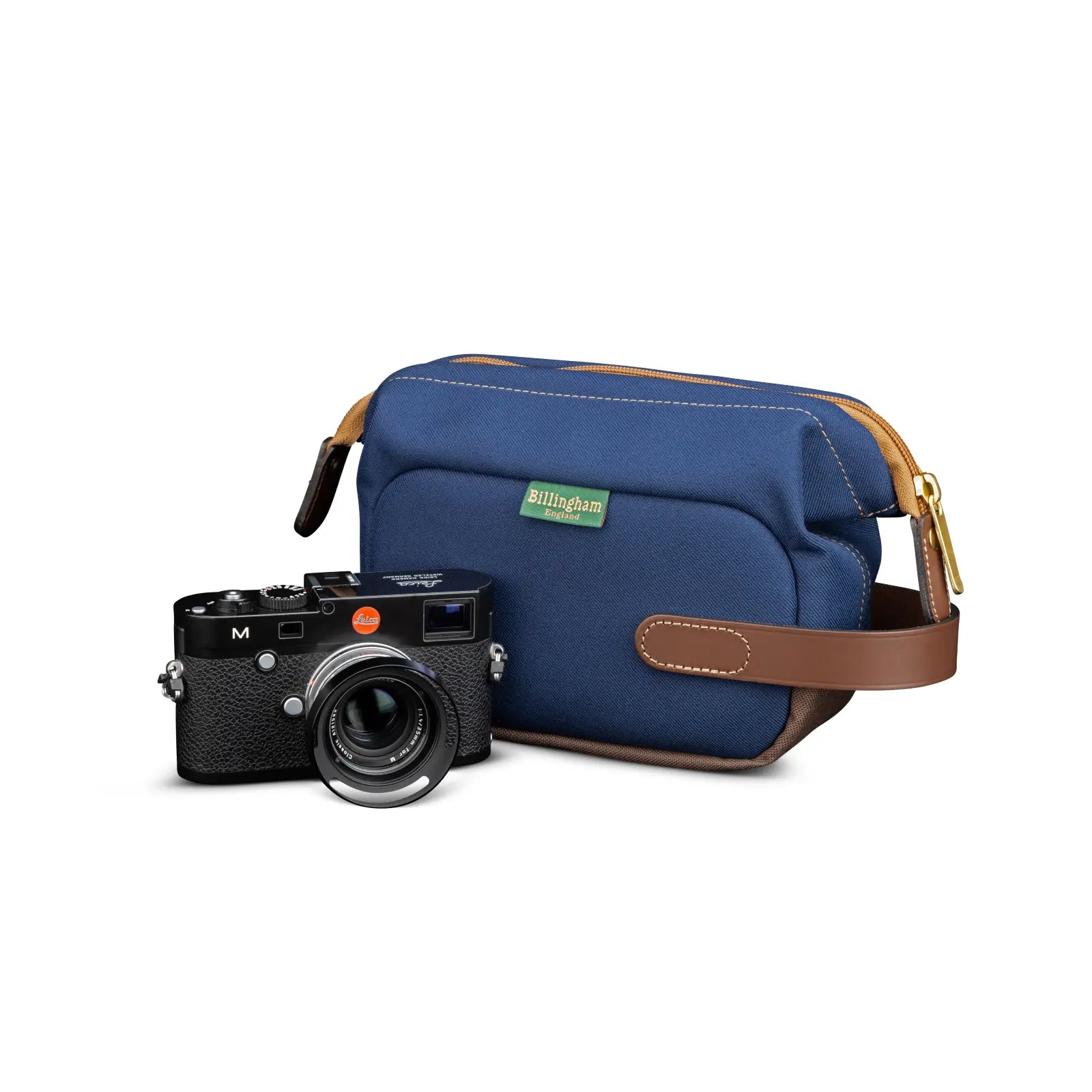 Camera and blue bag with brown strap on a white background
