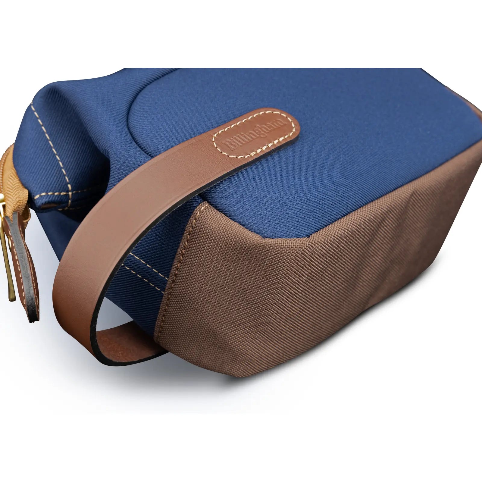 Blue and brown bag with leather strap on a white background
