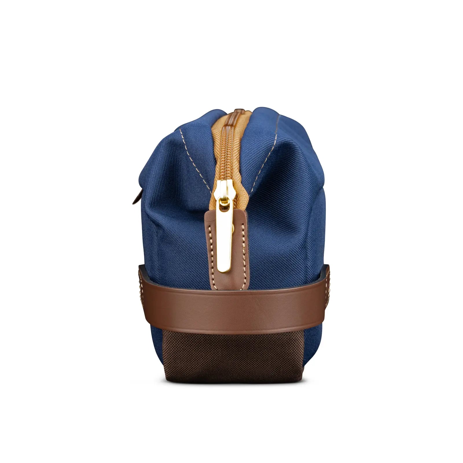 Blue duffel bag with brown leather strap and gold zipper on a white background