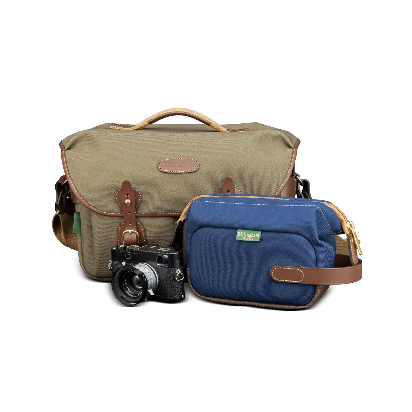 Two camera bags, one green and one blue, with a camera in front on a white background.