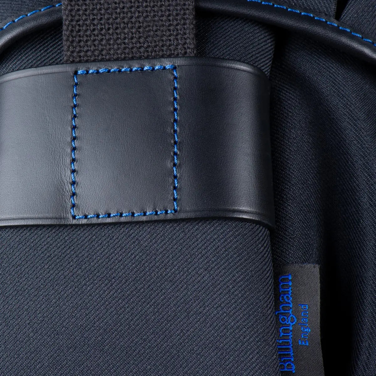 Close-up of a black bag with blue stitching and 'Bulwark' branding.