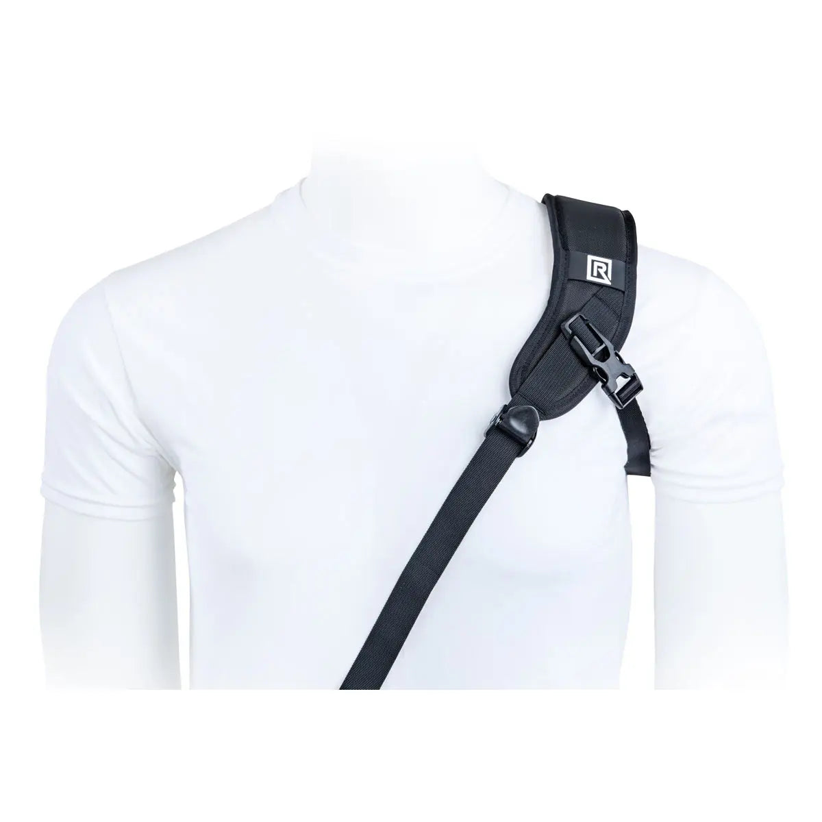 Black shoulder strap worn over a white shirt on a white background