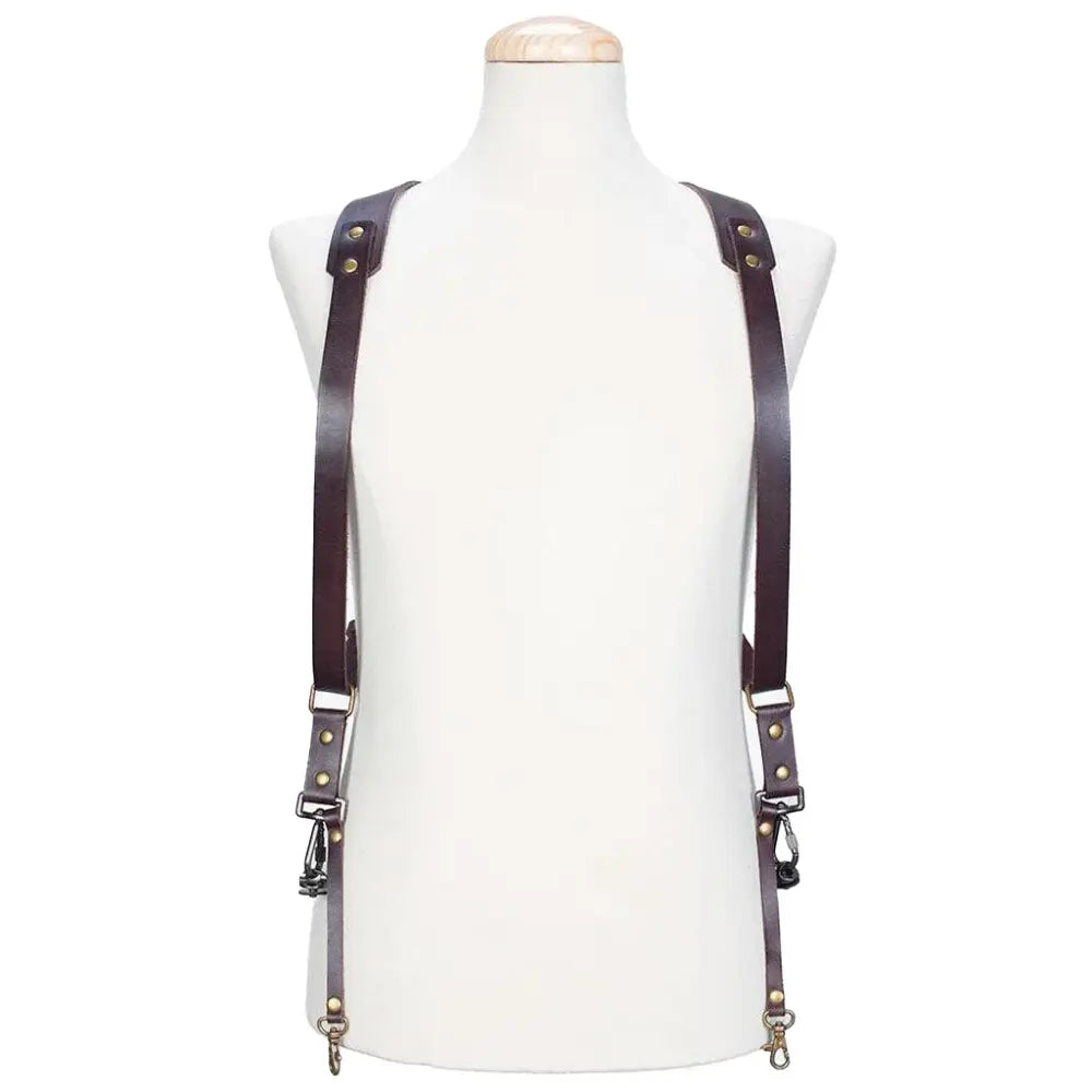 Brown leather suspenders on a mannequin against a white background