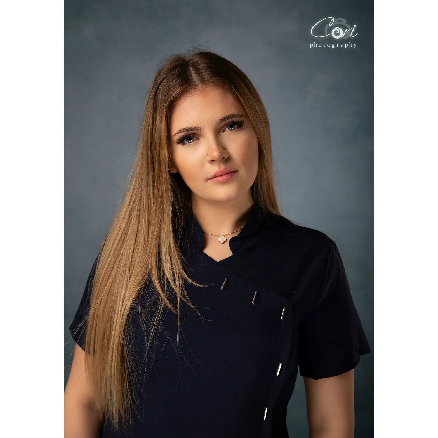 Woman wearing a black shirt against a gray background with 'Cort Photography' watermark.