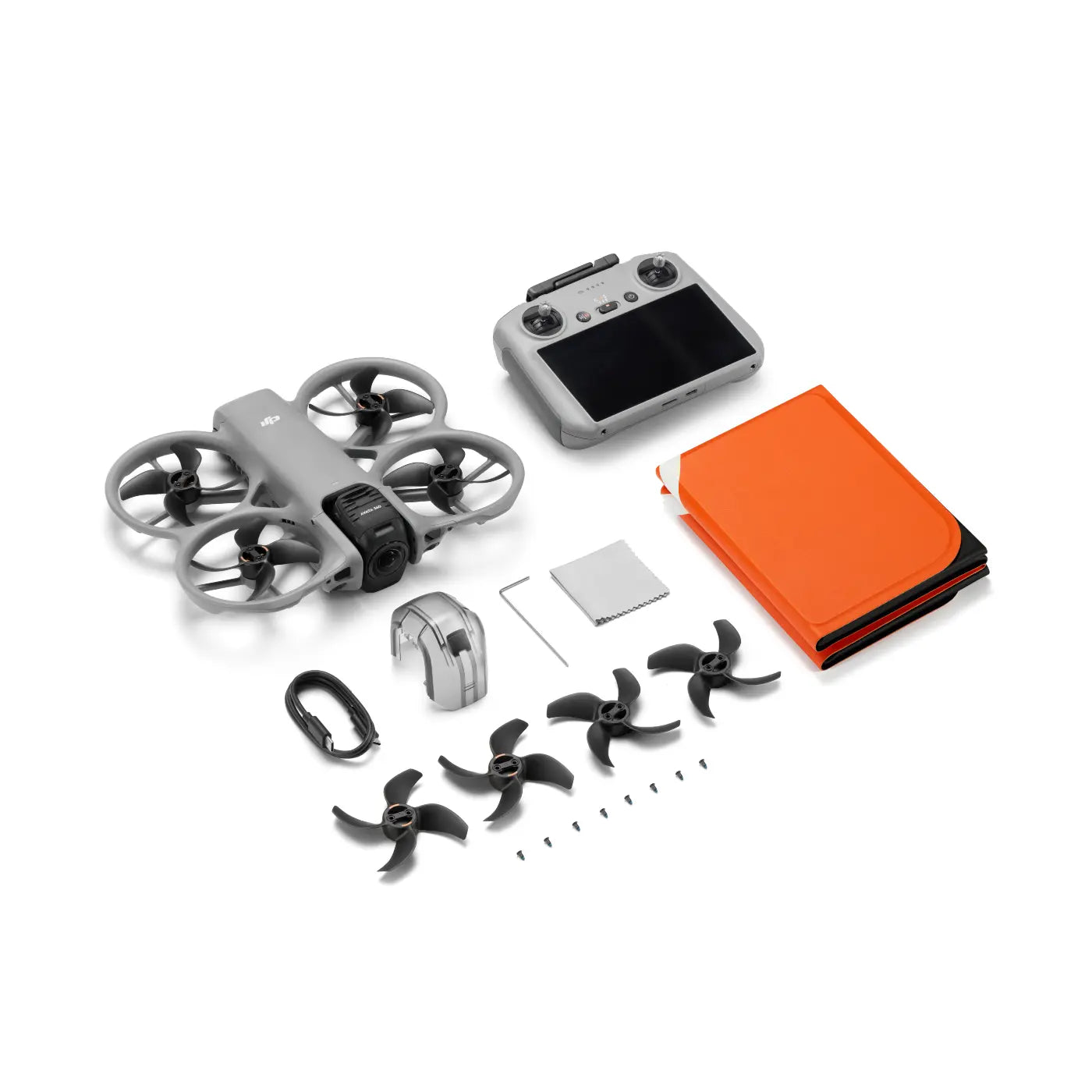 Drone components including drone, remote control, propellers, and battery on a white background