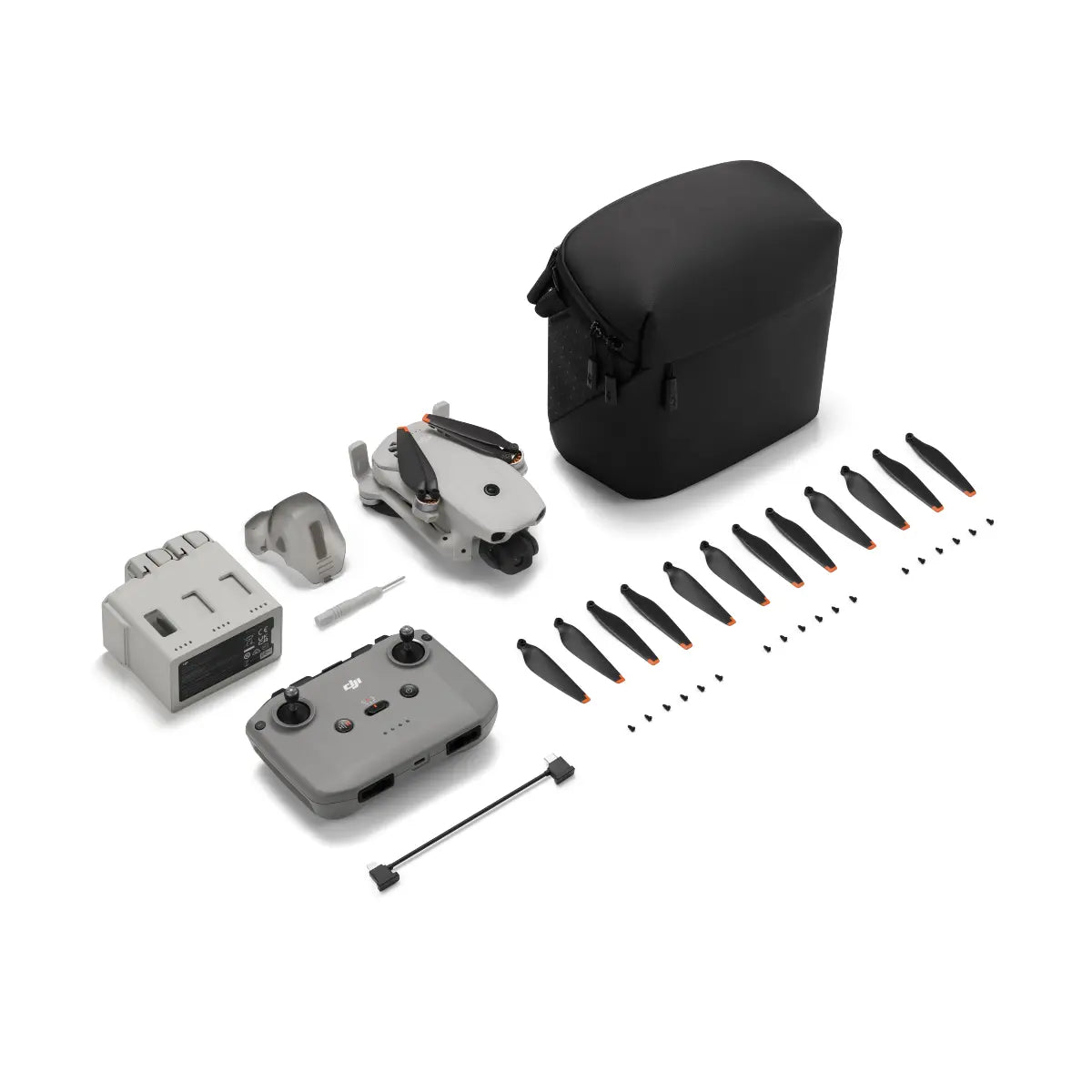 Drone parts including body, propellers, and accessories on a white background