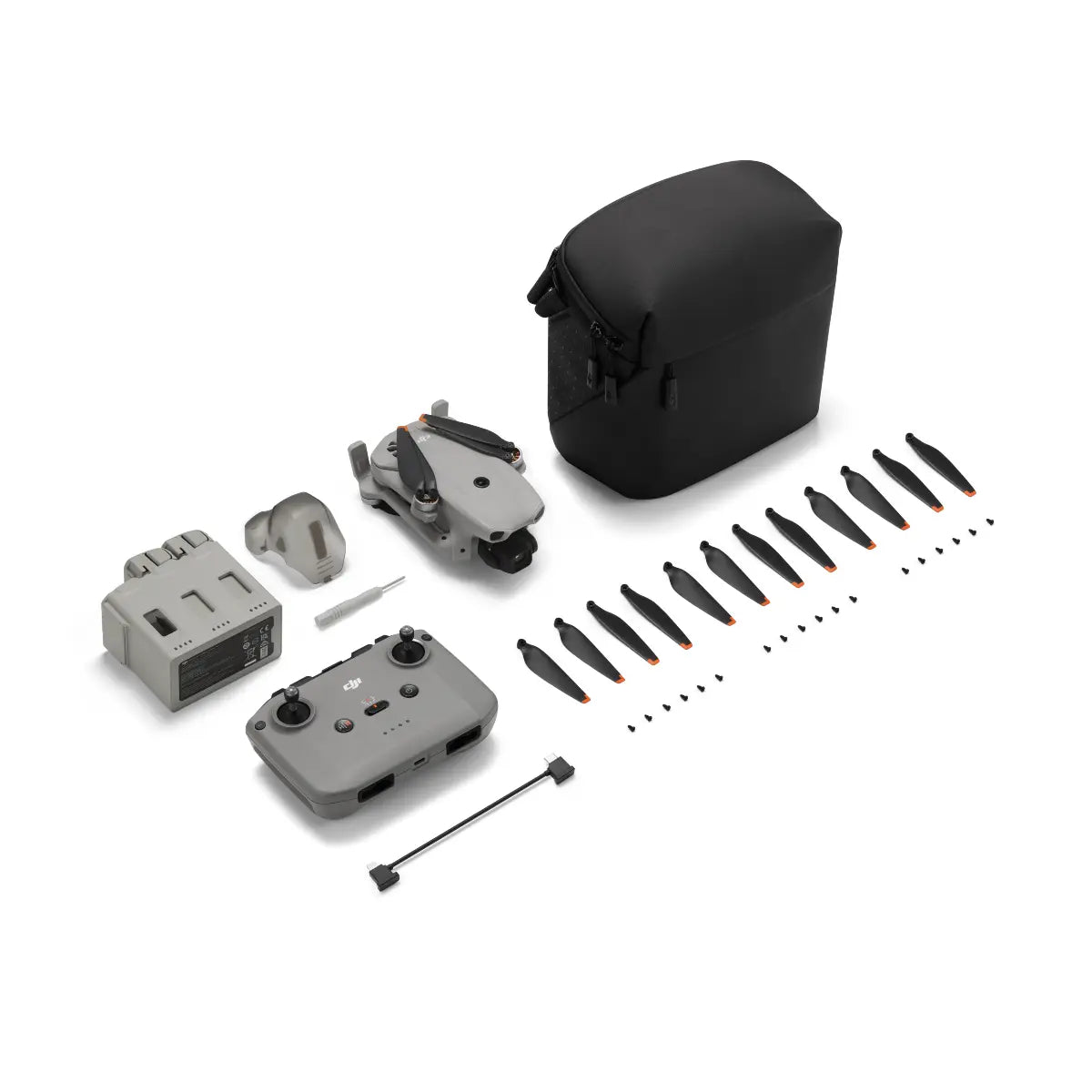 DJI Mavic Mini drone parts including body, propellers, and carrying case on a white background