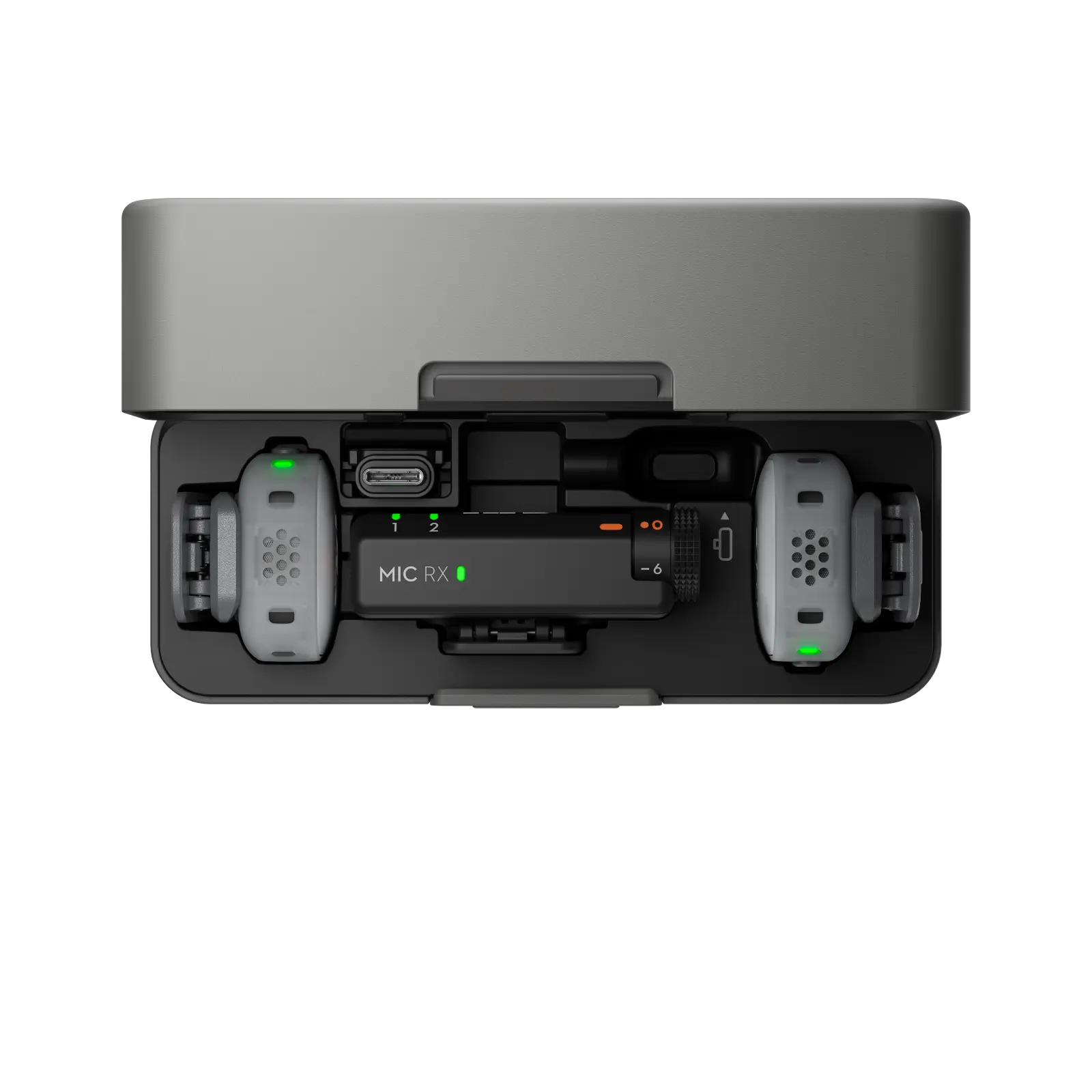 Top view of a gray electronic device with various components on a white background