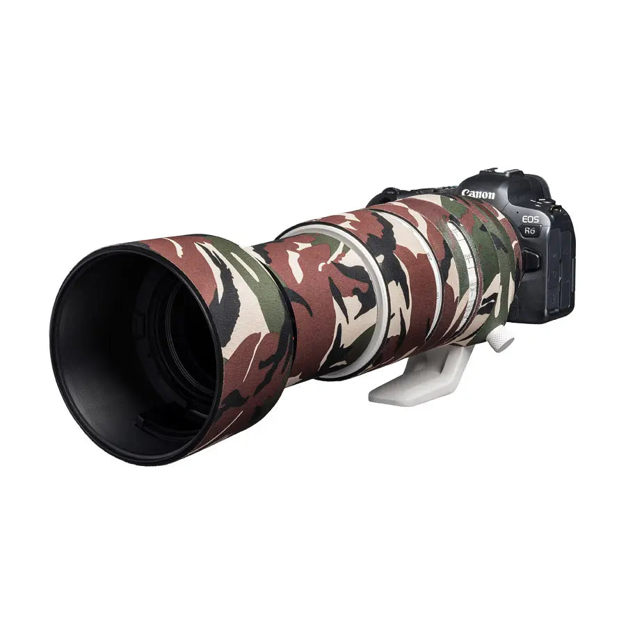Canon camera with a camouflage lens cover on a white background