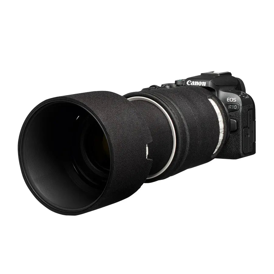 Canon camera with a large lens on a white background