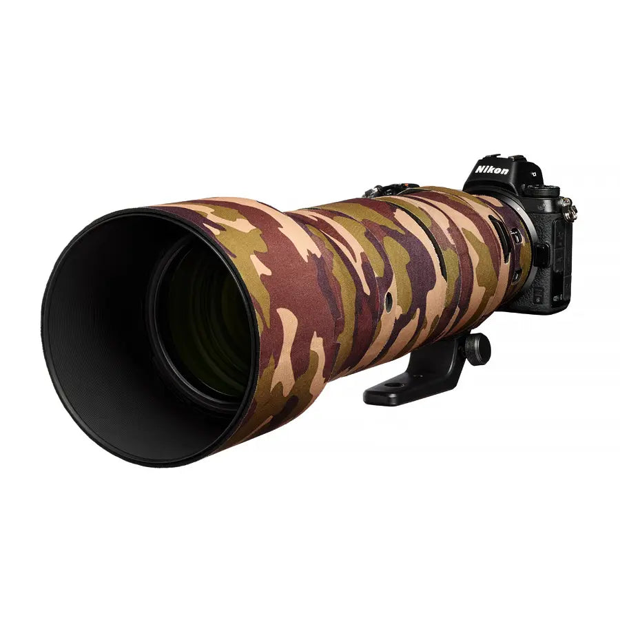 Camouflage lens cover on a camera lens with a Nikon camera body.