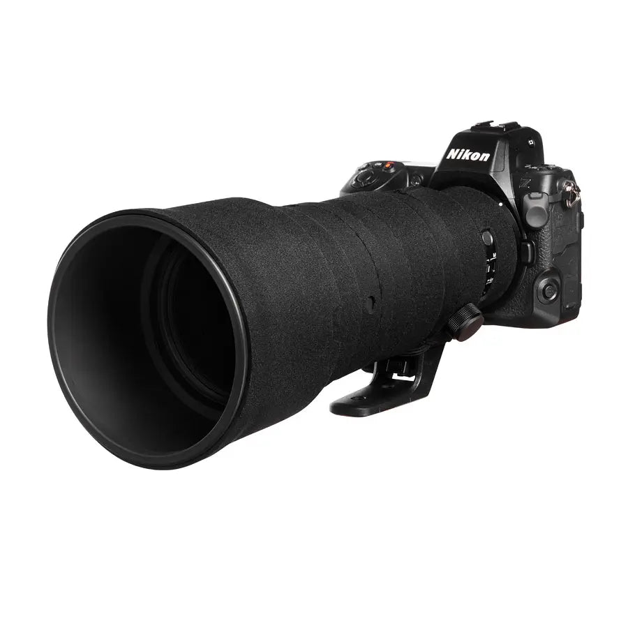 Nikon camera with a large lens on a white background