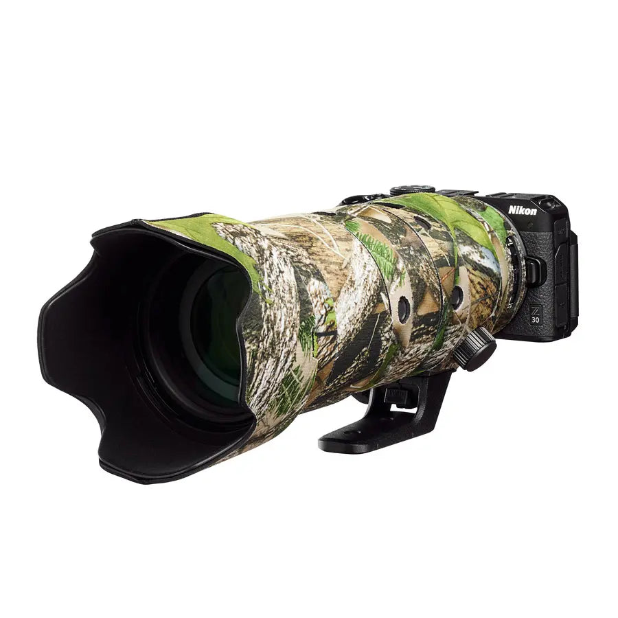 Camouflage camera lens with Nikon branding on a white background