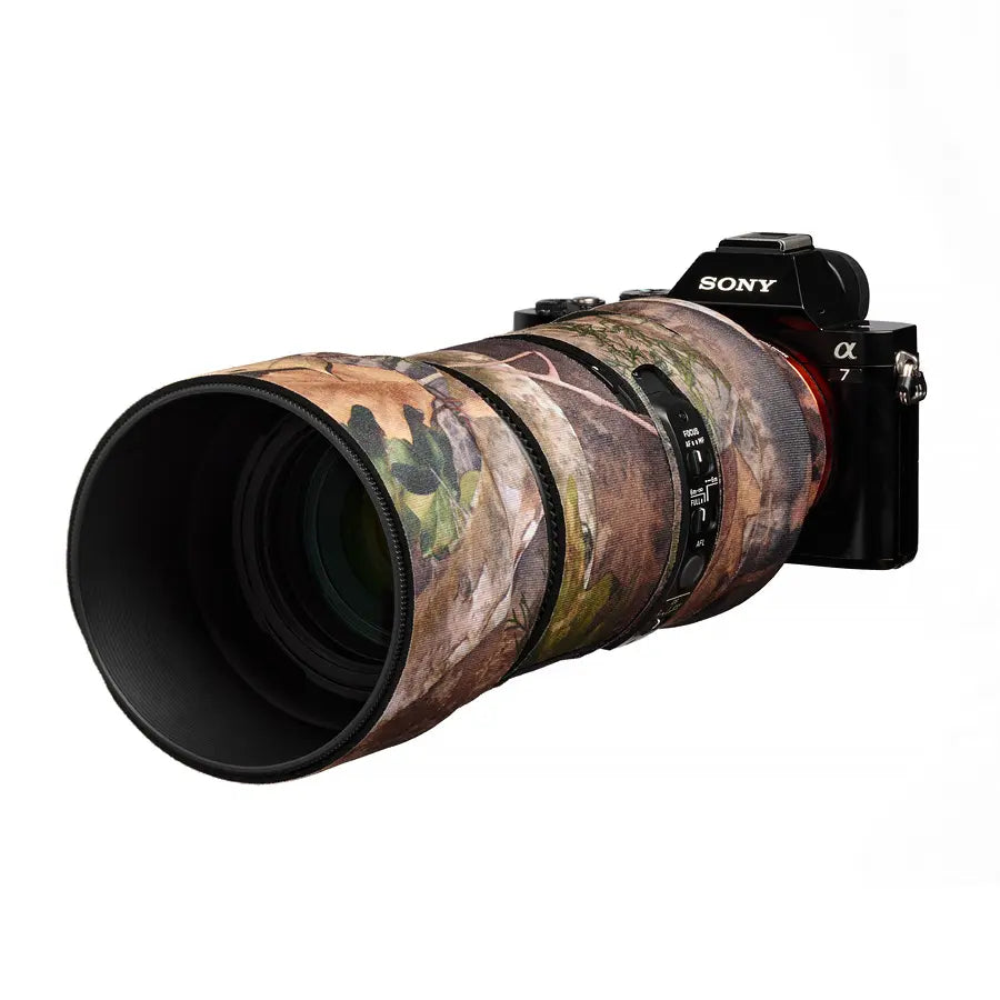 Camouflage-patterned camera lens with Sony branding on a white background